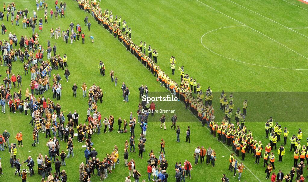 6 September 2009; Stewards and GardaÕ make a line to try and move Kilkenny supporters off the field. GAA Hurling All-Ireland Senior Championship Final, Kilkenny v Tipperary, Croke Park, Dublin. Picture credit: Daire Brennan / SPORTSFILE