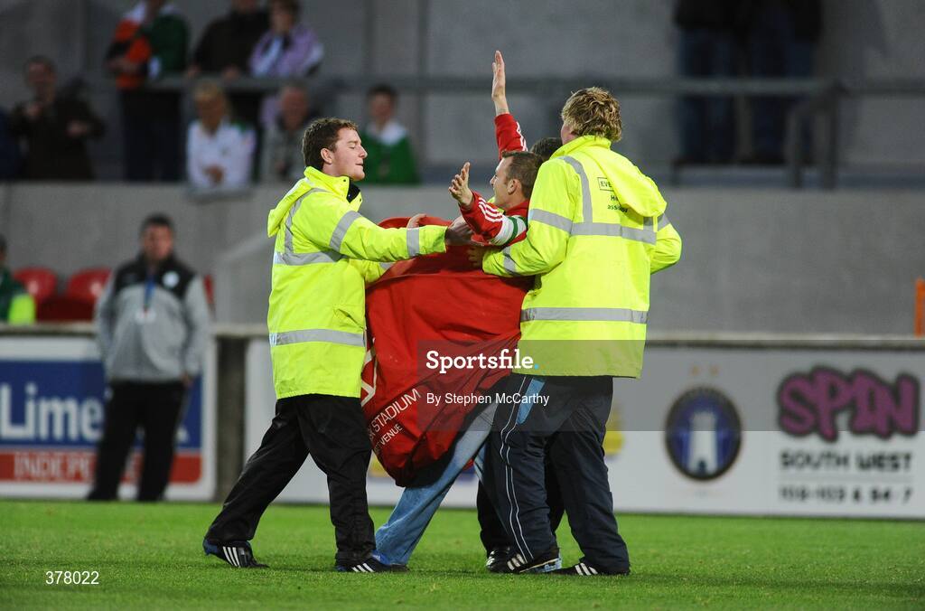 8 September 2009; A fan is escorted from the pitch after celebrating Liam Lawerence's first goal for the Republic of Ireland. International Friendly, Republic of Ireland v South Africa, Thomond Park, Limerick. Picture Credit: Stephen McCarthy / SPORTSFILE