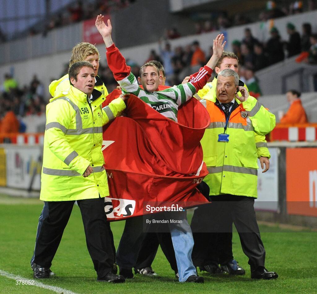 8 September 2009; A supporter is removed from the pitch after running on to congratulate Liam Lawrence for scoring the first goal. International Friendly, Republic of Ireland v South Africa, Thomond Park, Limerick. Picture Credit: Brendan Moran / SPORTSFILE