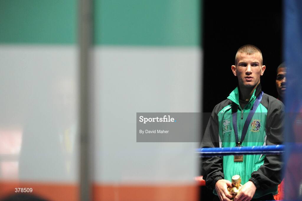 12 September 2009; John Joe Nevin, Ireland, stands during the playing of the National Anthem, after being presented with a bronze medal, following his defeat to Eduard Abzalimov, Russia, in their 54kg Bantamweight Semi-Final. AIBA World Boxing Championships, Final, Assago, Milan, Italy. Picture credit: David Maher / SPORTSFILE