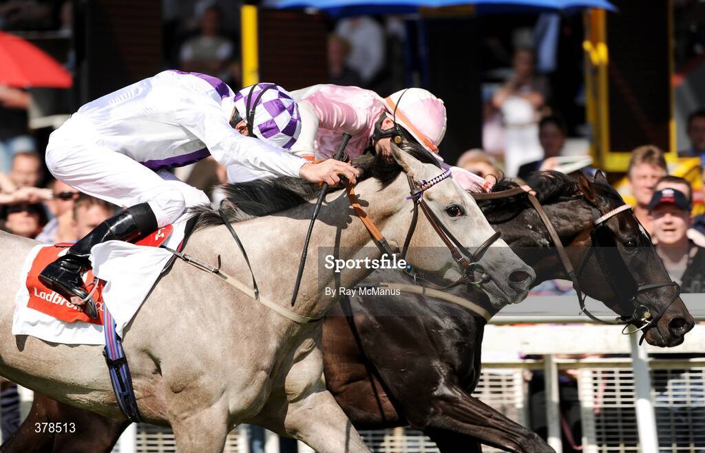 12 September 2009; Irish Heartbeat, on the rails, with Pat Smullen up, wins The ladbrokes.com Autumn Festival Handicap from Sioduill, with Kevin Manning up . The Curragh Racecourse, Co. Kildare. Picture credit: Ray McManus / SPORTSFILE