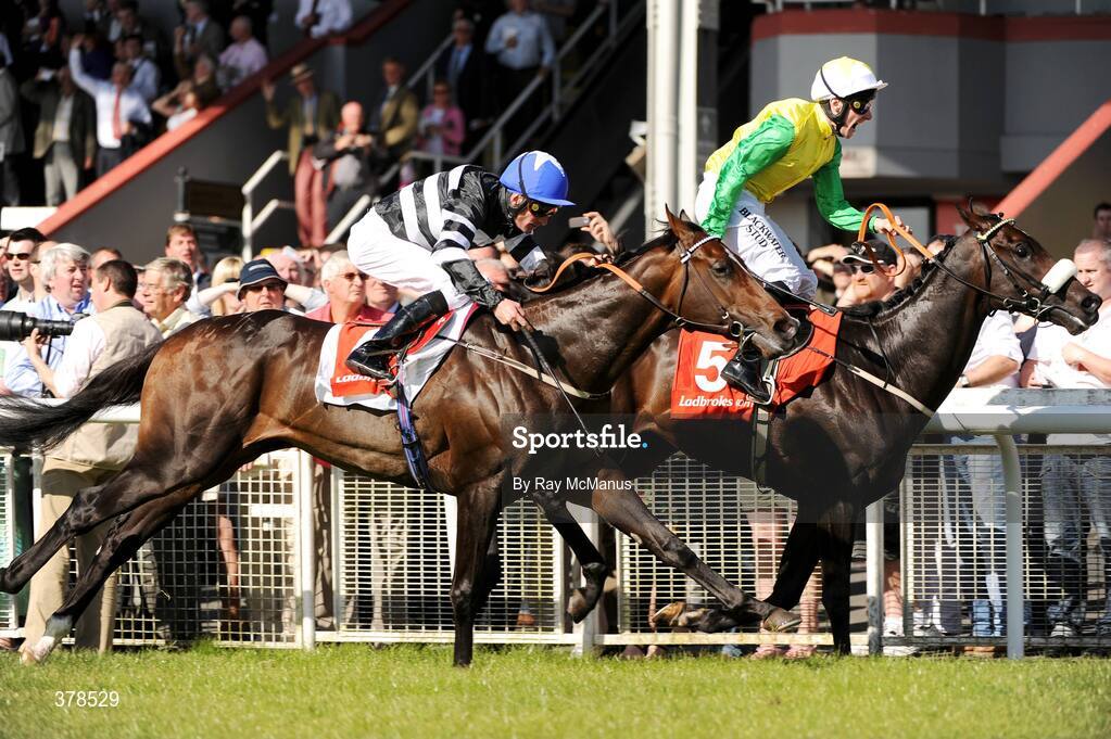 12 September 2009; Kingsfort, with Declan McDonagh up, on their way to winning The Vincent O'Brien National Stakes sponsored by ladbrokes.com from Kevin Manning on Chabai. The Curragh Racecourse, Co. Kildare. Picture credit: Ray McManus / SPORTSFILE