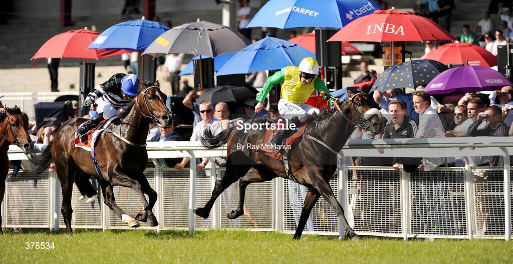 12 September 2009; Kingsfort, with Declan McDonagh up, on their way to winning The Vincent O'Brien National Stakes sponsored by ladbrokes.com from Kevin Manning on Chabai. The Curragh Racecourse, Co. Kildare. Picture credit: Ray McManus / SPORTSFILE