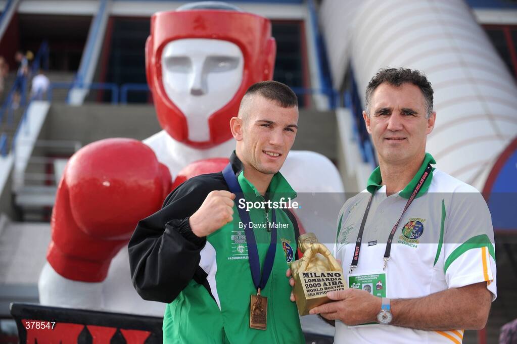 12 September 2009; John Joe Nevin, Ireland, celebrates with head coach Billy Walsh after being presented with a bronze medal following his defeat to Eduard Abzalimov, Russia, in their 54kg Bantamweight Semi-Final. AIBA World Boxing Championships, Final, Assago, Milan, Italy. Picture credit: David Maher / SPORTSFILE