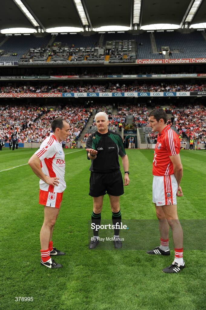 23 August 2009; Referee John Bannon tosses the coin in front of Tyrone captain Brian Dooher and Cork captain Graham Canty before the game. GAA Football All-Ireland Senior Championship Semi-Final, Tyrone v Cork, Croke Park, Dublin. Picture credit: Ray McManus / SPORTSFILE