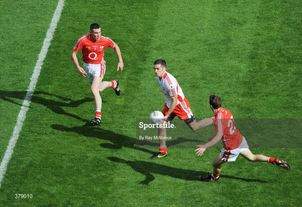 23 August 2009; Philip Jordan, Tyrone, in action against Noel O'Leary, left, and John Hayes, Cork. GAA Football All-Ireland Senior Championship Semi-Final, Tyrone v Cork, Croke Park, Dublin. Picture credit: Ray McManus / SPORTSFILE