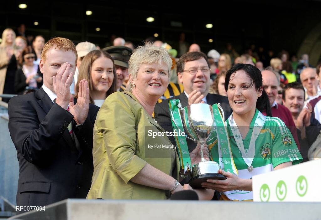 13 September 2009; President of the Camogie Association Joan O'Flynn presents the New Ireland trophy to Offaly captain Marion Crean in the presence of Gary Desmond, CEO of Gala, Sinead O'Connor, Ard Stuirthoir, and An Taoiseach Brian Cowen T.D. after the Gala All-Ireland Camogie Championship Finals. Croke Park, Dublin. Picture credit: Pat Murphy / SPORTSFILE
