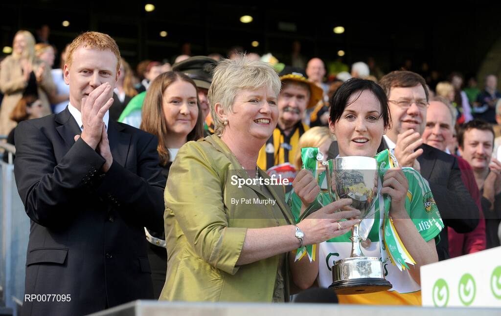 13 September 2009; President of the Camogie Association Joan O'Flynn presents the New Ireland trophy to Offaly captain Marion Crean in the presence of Gary Desmond, CEO of Gala, Sinead O'Connor, Ard Stuirthoir, and An Taoiseach Brian Cowen T.D. after the Gala All-Ireland Camogie Championship Finals. Croke Park, Dublin. Picture credit: Pat Murphy / SPORTSFILE