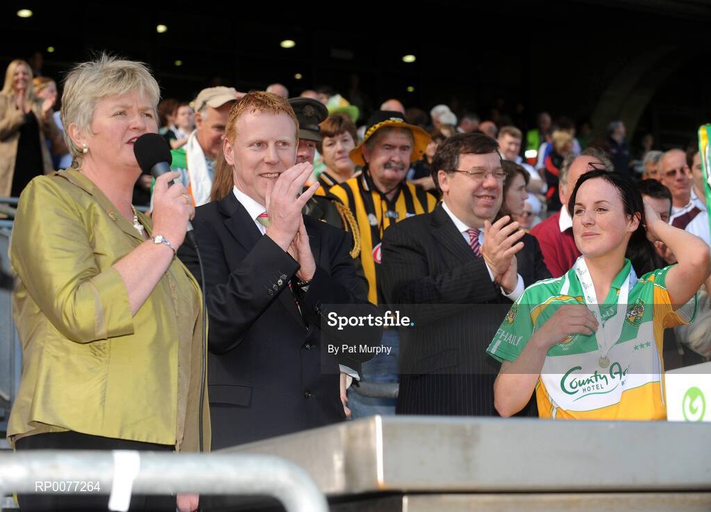 13 September 2009; President of the Camogie Association Joan O'Flynn speaking after the Gala All-Ireland Junior Camogie Championship Final while Gary Desmond, CEO, Gala, An Taoiseach Brian Cowen and winning Offaly captain Marion Crean look on. Offaly v Waterford. Croke Park, Dublin. Picture credit: Pat Murphy / SPORTSFILE