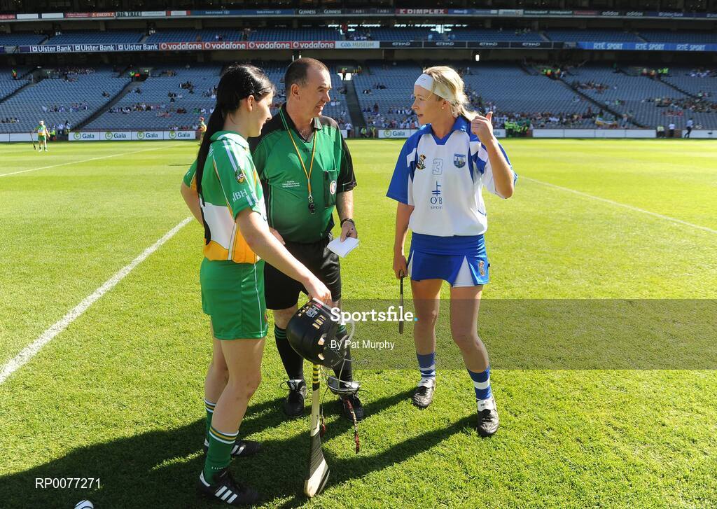 13 September 2009; Waterford captain Sally O'Grady decides which way her team will play after winning the toss while referee Pat Walsh and Offaly captain Marion Crean, left, look on before the Gala All-Ireland Junior Camogie Championship Final. Offaly v Waterford. Croke Park, Dublin. Picture credit: Pat Murphy / SPORTSFILE