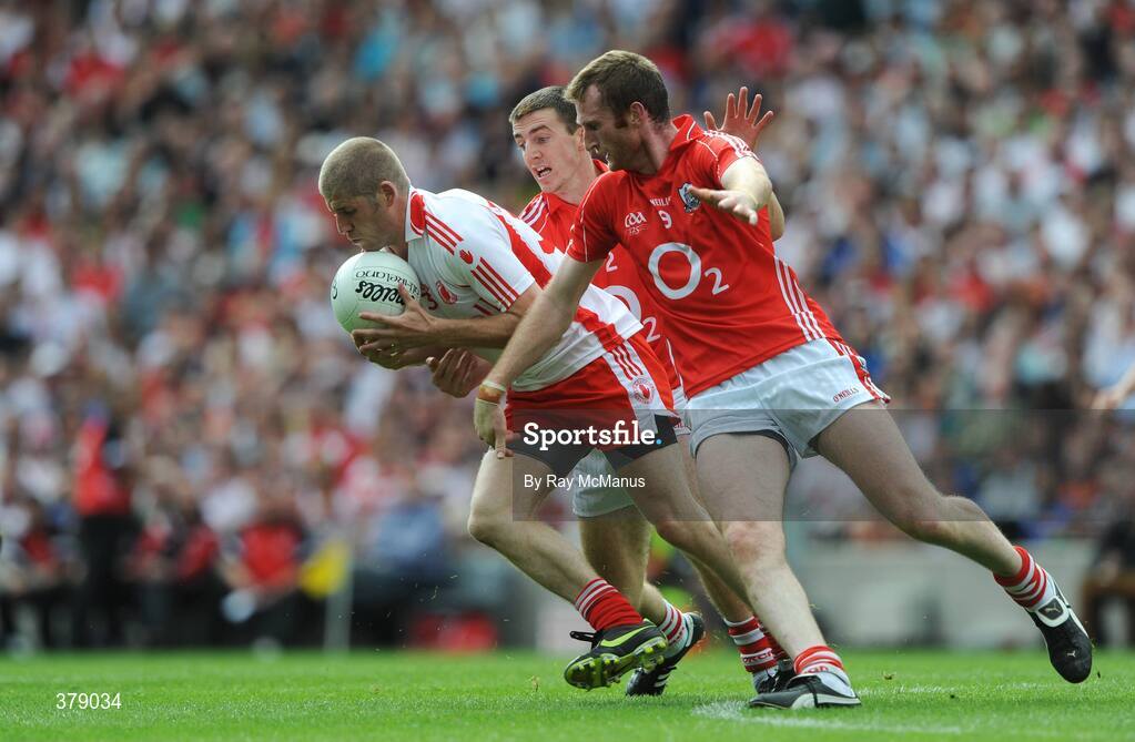 23 August 2009; Kevin Hughes, Tyrone, is tackled by Nicholas Murphy and Ray Carey, Cork. GAA Football All-Ireland Senior Championship Semi-Final, Tyrone v Cork, Croke Park, Dublin. Picture credit: Ray McManus / SPORTSFILE