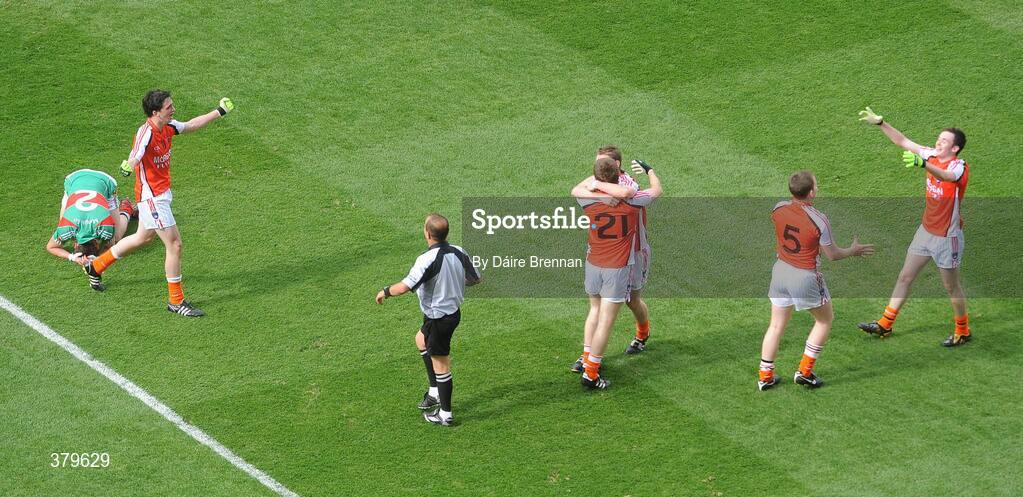 20 September 2009; Armagh players celebrate the final whistle while Michael Walsh, Mayo, lies dejected on the ground. ESB GAA Football All-Ireland Minor Championship Final, Armagh v Mayo, Croke Park, Dublin. Picture credit: Dáire Brennan / SPORTSFILE