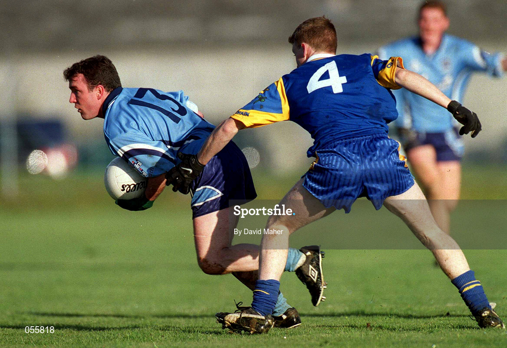 21 January 2001; Niall O'Donoghue of Dublin is tackled by Thomas Burke of Wicklow during the O'Byrne Cup Quarter-Final match between Wicklow and Dublin at the County Grounds in Aughrim, Wicklow. Photo by David Maher/Sportsfile