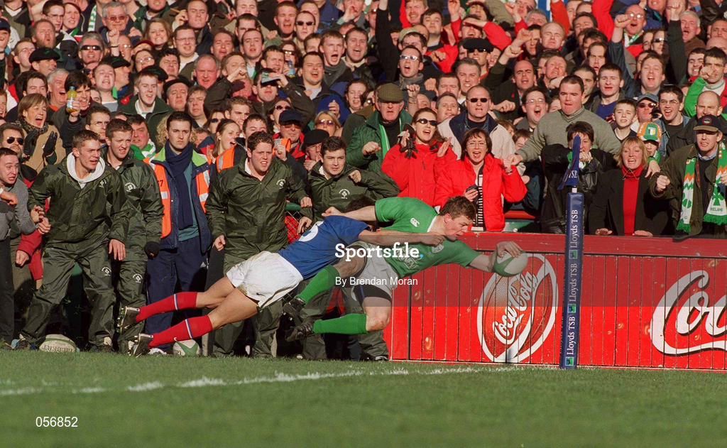17 February 2001; Brian O'Driscoll of Ireland goes over for a try despite the efforts of Xavier Garabajosa of France during the Lloyds TSB Six Nations Rugby Championship match between Ireland and France at Lansdowne Road in Dublin. Photo by Brendan Moran/Sportsfile