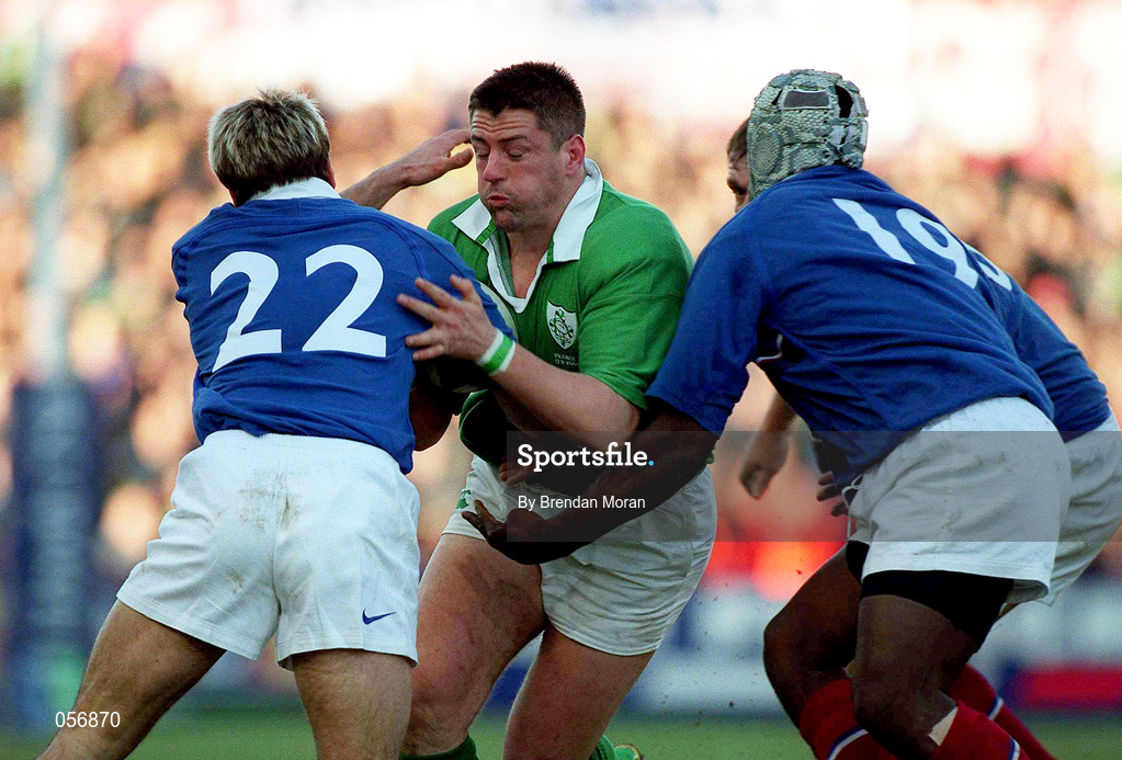 17 February 2001; Emmet Byrne of Ireland is tackled by Christophe Dominici and Serge Betsen, right, of France during the Lloyds TSB Six Nations Rugby Championship match between Ireland and France at Lansdowne Road in Dublin. Photo by Brendan Moran/Sportsfile
