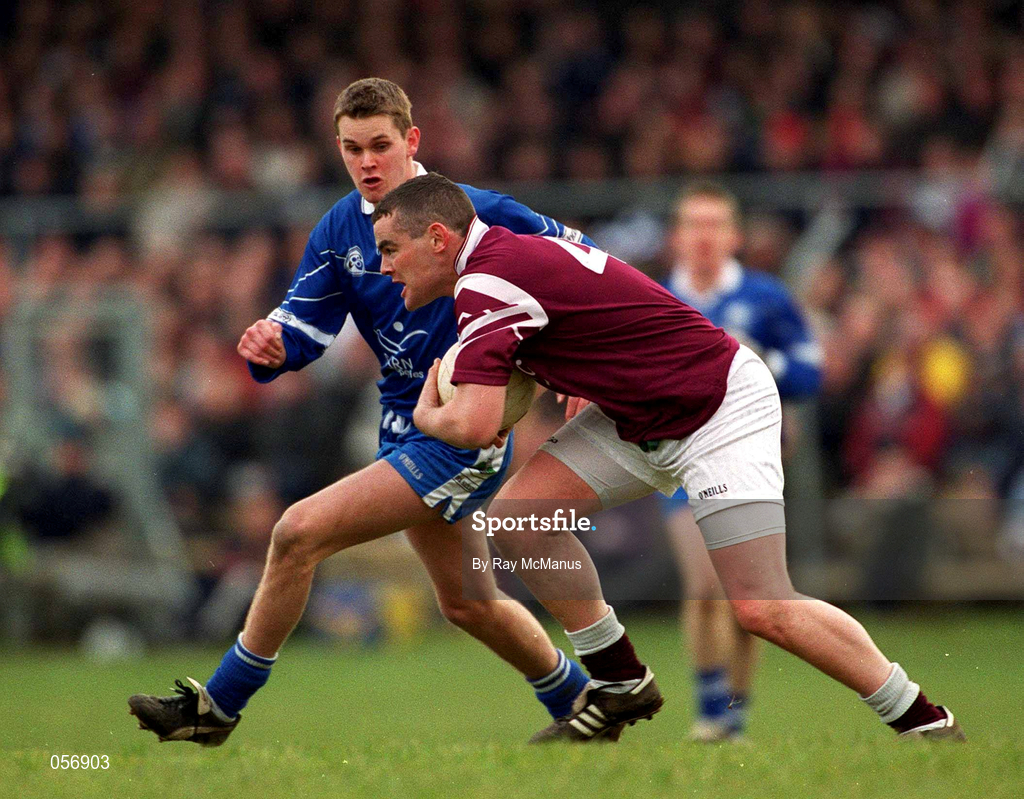 18 February 2001; Colm Reilly of Crossmolina Deel Rovers is tackled by Gavin Diamond of Bellaghy Wolfe Tones during the AIB All-Ireland Senior Club Football Championship Semi-Final match between Crossmolina Deel Rovers v Bellaghy Wolfe Tones at Brewster Park in Enniskillen, Fermanagh. Photo by Ray McManus/Sportsfile