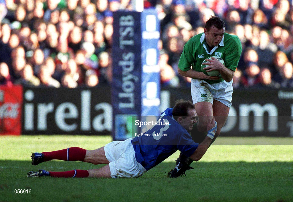 17 February 2001; Rob Henderson of Ireland is tackled by Richard Dourthe of France during the Lloyds TSB Six Nations Rugby Championship match between Ireland and France at Lansdowne Road in Dublin. Photo by Brendan Moran/Sportsfile