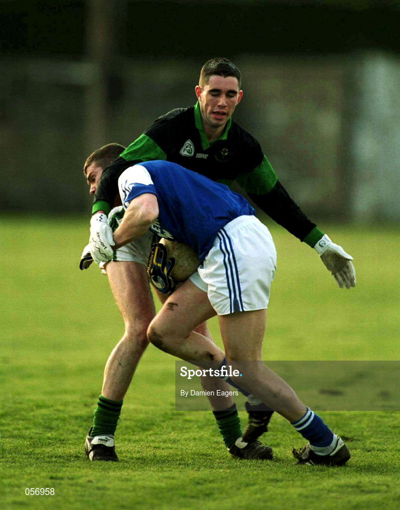 18 February 2001; Philip Nolan of O'Hanrahan's in action against David Niblock of Nemo Rangers during the AIB All-Ireland Senior Club Football Championship Semi-Final match between Nemo Rangers and O'Hanrahan's at Clonmel Sportsfield in Clonmel, Tipperary. Photo by Damien Eagers/Sportsfile