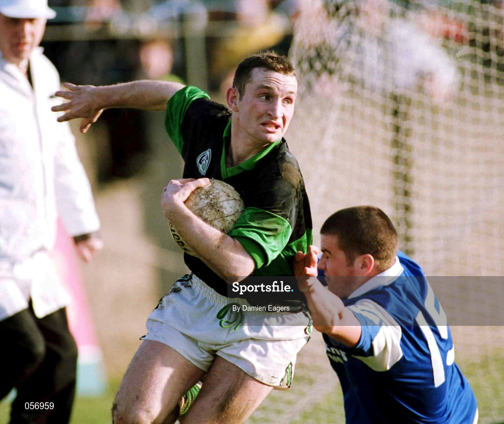18 February 2001; Sean O'Brien of Nemo Rangers is tackled by Seamus Farrell of O'Hanrahan's during the AIB All-Ireland Senior Club Football Championship Semi-Final match between Nemo Rangers and O'Hanrahan's at Clonmel Sportsfield in Clonmel, Tipperary. Photo by Damien Eagers/Sportsfile