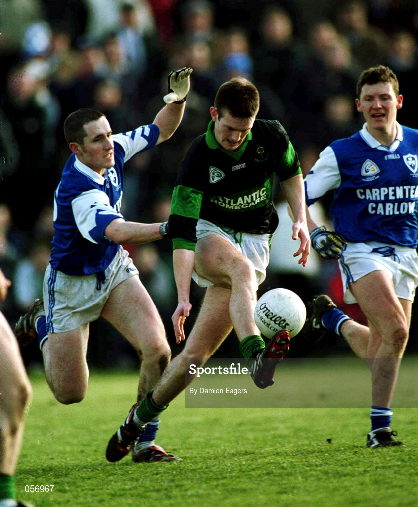 18 February 2001; Derek Kavanagh of Nemo Rangers is tackled by Ken Walker of O'Hanrahan's, left, during the AIB All-Ireland Senior Club Football Championship Semi-Final match between Nemo Rangers and O'Hanrahan's at Clonmel Sportsfield in Clonmel, Tipperary. Photo by Damien Eagers/Sportsfile