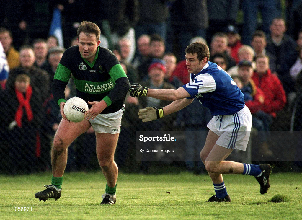 18 February 2001; Colin Corkery of Nemo Rangers is tackled by Andrew Corden of O'Hanrahan's during the AIB All-Ireland Senior Club Football Championship Semi-Final match between Nemo Rangers and O'Hanrahan's at Clonmel Sportsfield in Clonmel, Tipperary. Photo by Damien Eagers/Sportsfile