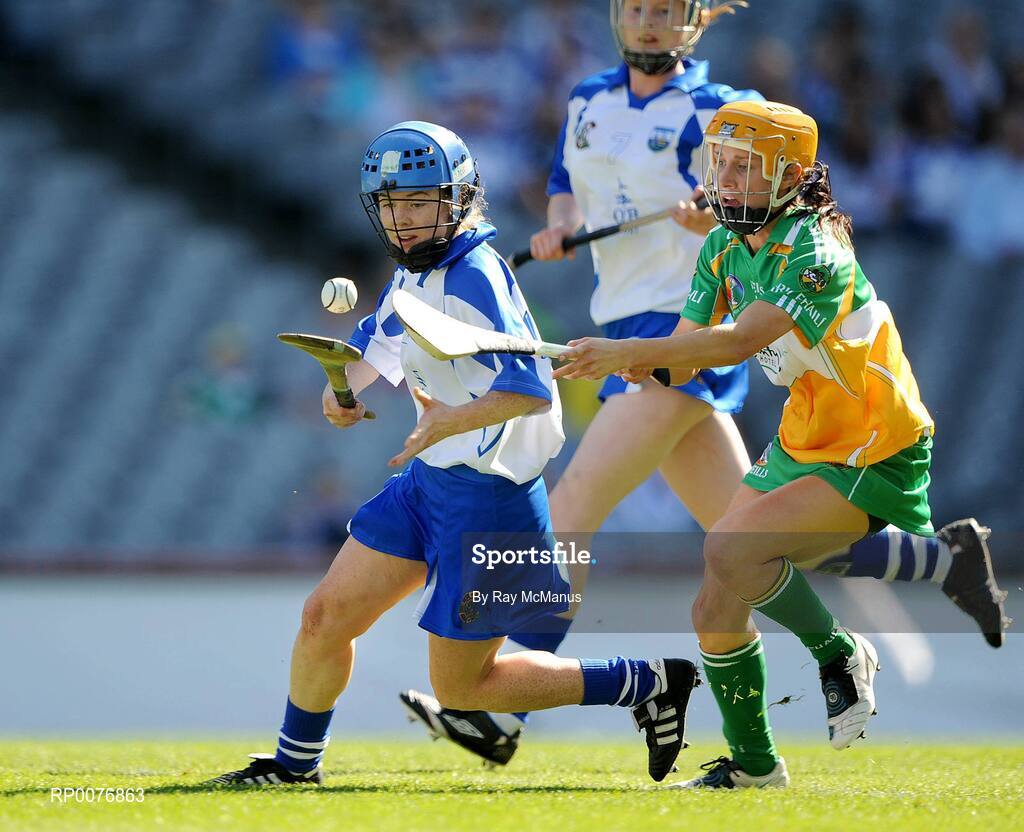 13 September 2009; Kate Marie Hearne, Waterford, clears under pressure from Michelle Davis, Offaly . Gala All-Ireland Junior Camogie Championship Final, Offaly v Waterford, Croke Park, Dublin. Picture credit: Ray McManus / SPORTSFILE