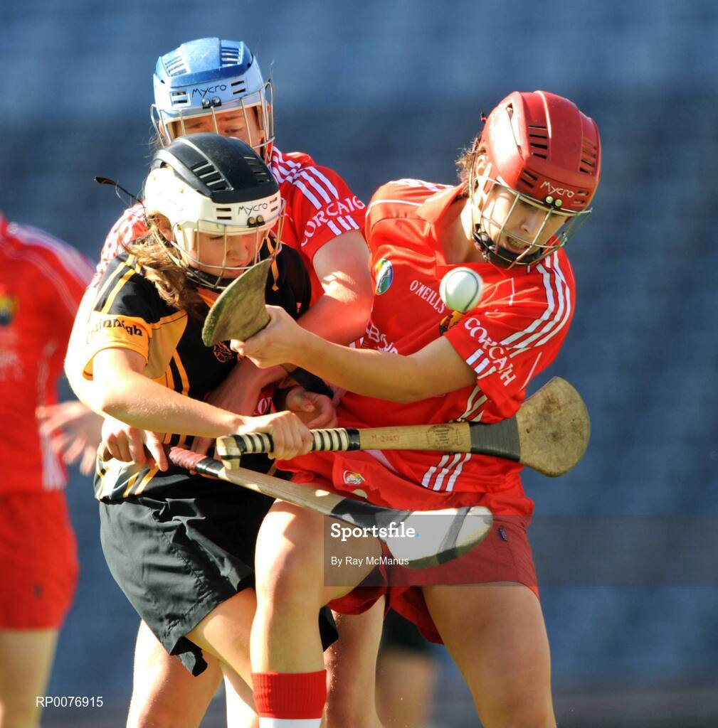 13 September 2009; Michelle Quilty, Kilkenny, is tackled by Cork backs Cliona Foley, red helmet, and Rena Buckley. Gala All-Ireland Senior Camogie Championship Final, Cork v Kilkenny, Croke Park, Dublin. Picture credit: Ray McManus / SPORTSFILE