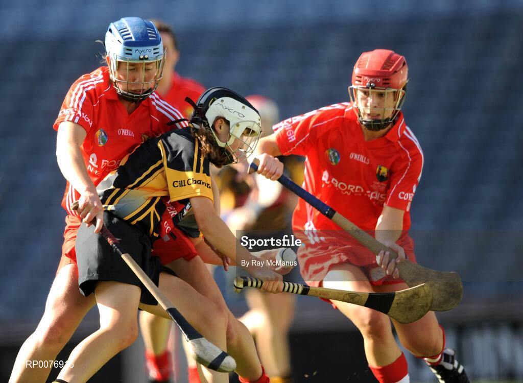 13 September 2009; Michelle Quilty, Kilkenny, is tackled by Cork backs Cliona Foley, red helmet, and Rena Buckley. Gala All-Ireland Senior Camogie Championship Final, Cork v Kilkenny, Croke Park, Dublin. Picture credit: Ray McManus / SPORTSFILE