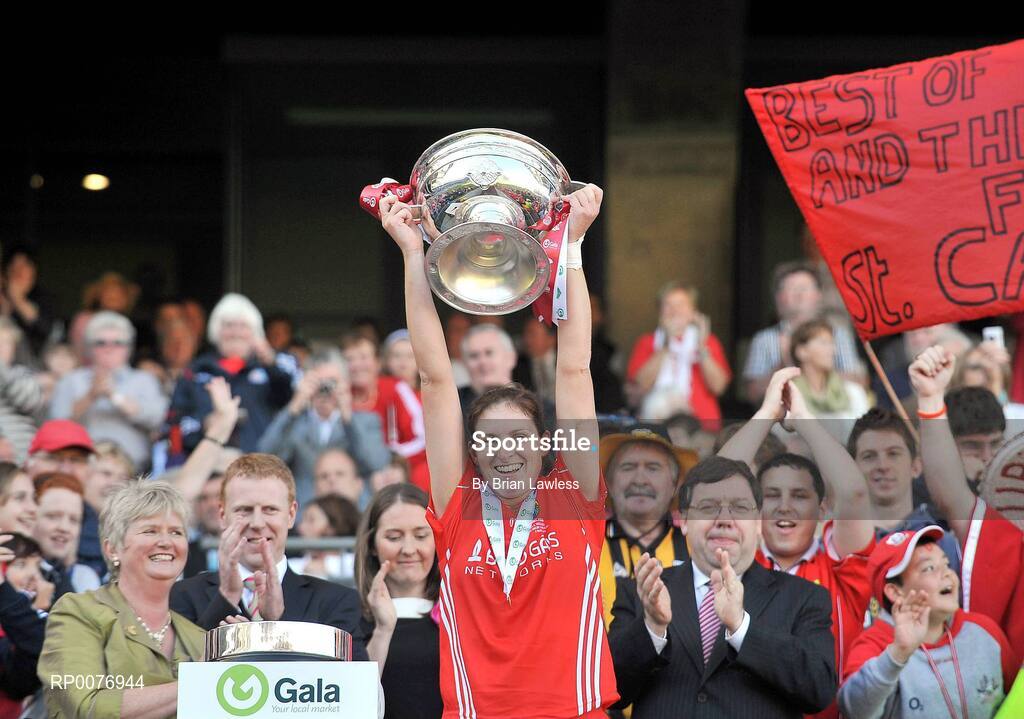 13 September 2009; Cork captain Amanda O'Regan lifts the cup in the company of An Taoiseach Brian Cowen TD and President of the Camogie Association Joan O'Flynn. Gala All-Ireland Senior Camogie Championship Final, Cork v Kilkenny, Croke Park, Dublin. Picture credit: Brian Lawless / SPORTSFILE