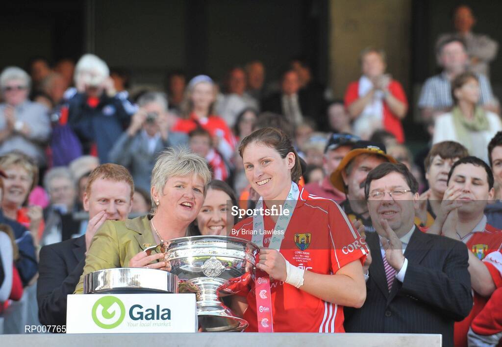 13 September 2009; Cork captain Amanda O'Regan is presented with the cup by President of the Camogie Association Joan O'Flynn in the company of An Taoiseach Brian Cowen TD. Gala All-Ireland Senior Camogie Championship Final, Cork v Kilkenny, Croke Park, Dublin. Picture credit: Brian Lawless / SPORTSFILE