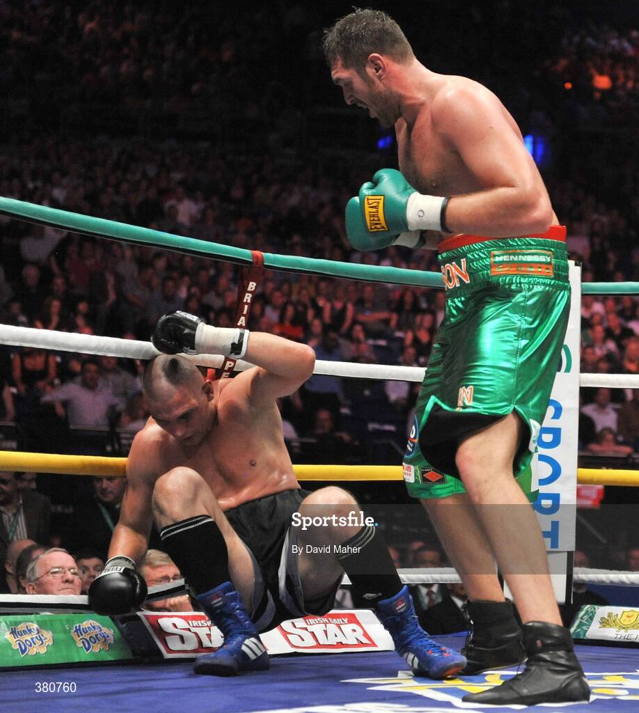 26 September 2009; Tyson Fury, right, knocks down  Tomas Mrazek during the final round during their International Heavyweight bout. Hunky Dorys Fight Night Undercard, The O2, Dublin. Picture credit: David Maher / SPORTSFILE