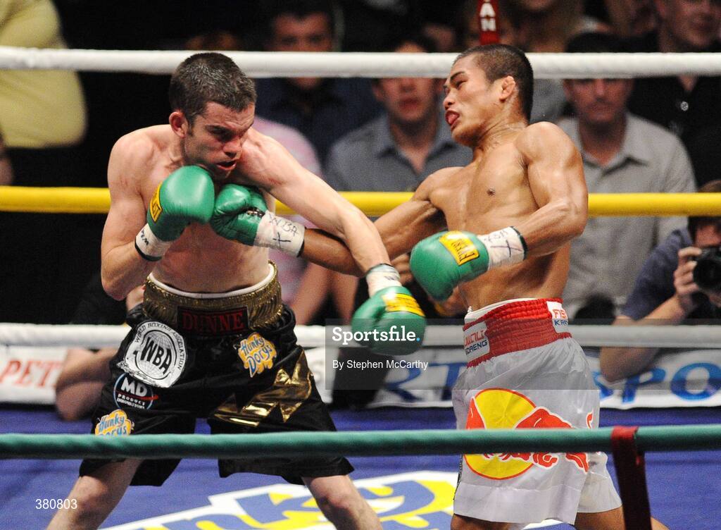 26 September 2009; Poonsawat Kratingdaenggym, right, exchanges punches with Bernard Dunne during the second round of their WBA World Super Bantamweight title fight. Hunky Dorys World Title Fight Night, Bernard Dunne v Poonsawat Kratingdaenggym, The O2, Dublin. Picture credit: Stephen McCarthy / SPORTSFILE