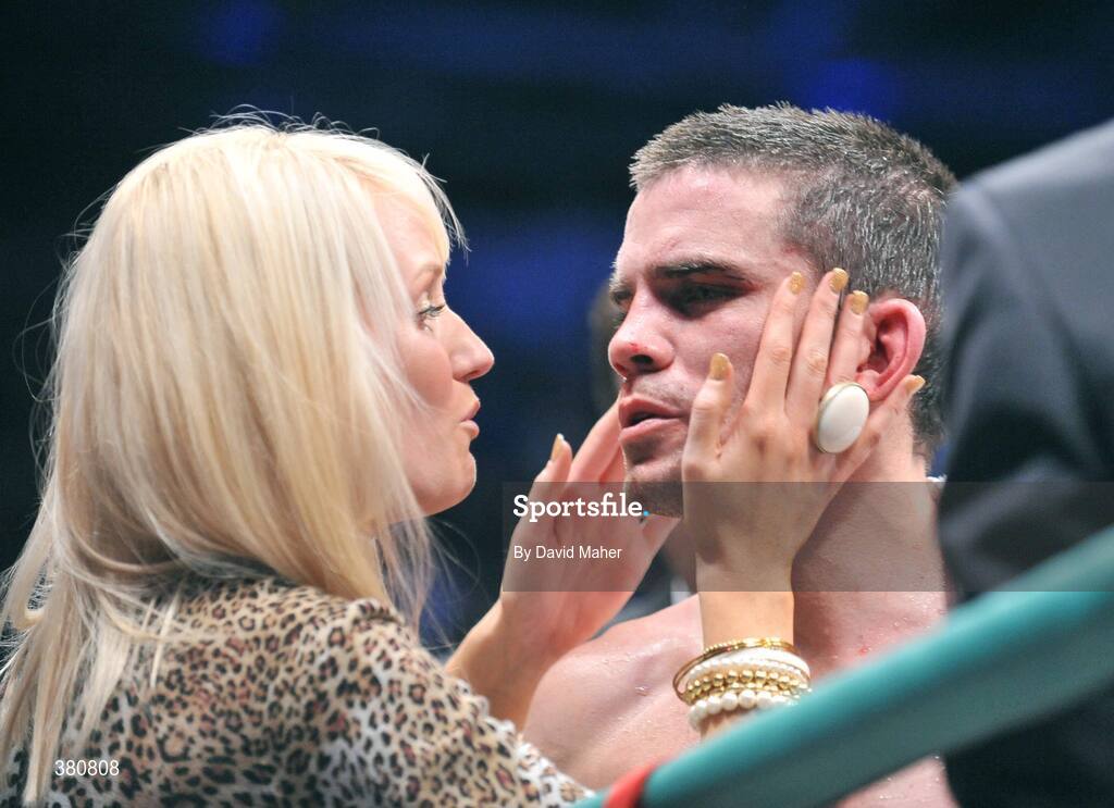 26 September 2009; Bernard Dunne is comforted by his wife Pamela after being defeated by Poonsawat Kratingdaenggym on the three knockdown rule after 2 minutes 57 seconds of the third round of their WBA World Super Bantamweight title fight. Hunky Dorys World Title Fight Night, Bernard Dunne v Poonsawat Kratingdaenggym, The O2, Dublin. Picture credit: David Maher / SPORTSFILE