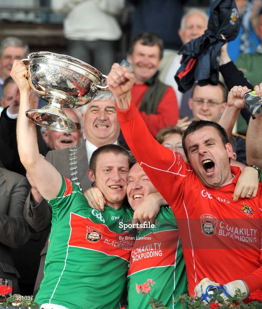 27 September 2009; Timmy Anglin, Clonakilty captain, left, lifts the cup with team-mates Brendan Walsh and Eamon Harte, right. Cork County Senior Football Final, St. Finbarr's v Clonakilty, Páirc Uí Chaoimh, Cork. Picture credit: Brian Lawless / SPORTSFILE
