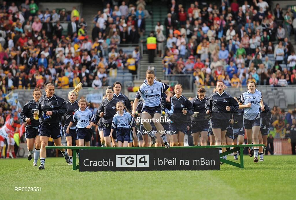 27 September 2009; Dublin captain Denise Masterson leads her side out for the team picture. TG4 All-Ireland Ladies Football Senior Championship Final, Cork v Dublin, Croke Park, Dublin. Picture credit: Stephen McCarthy / SPORTSFILE