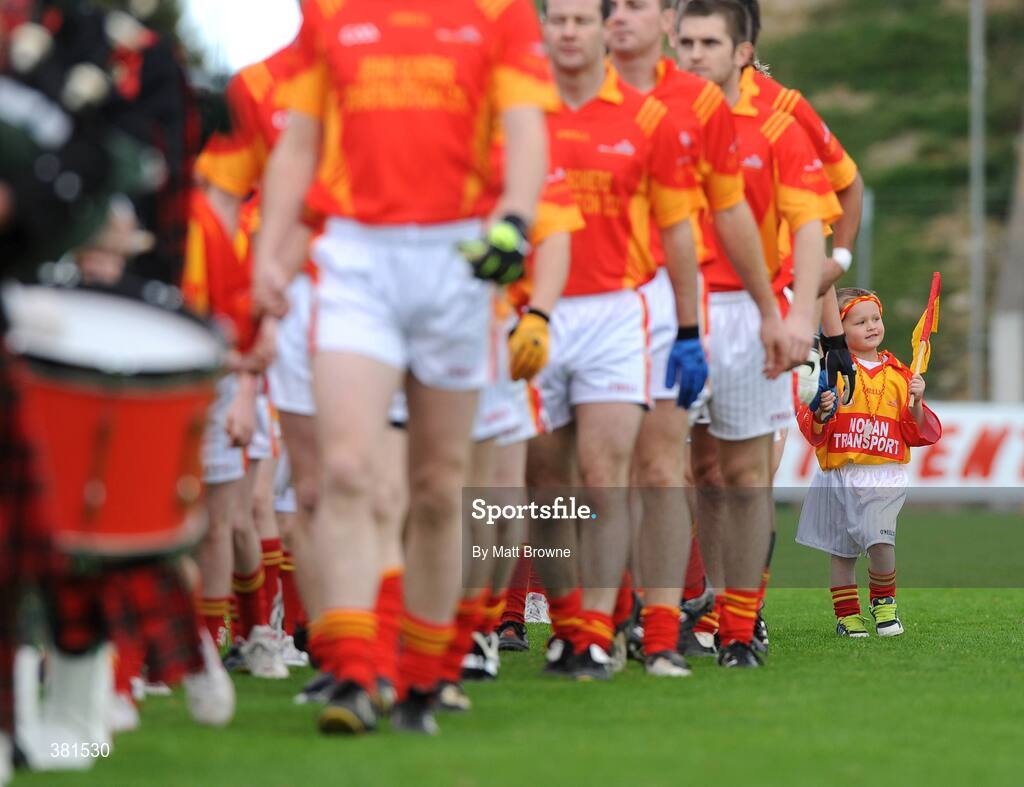 4 October 2009; Five year old Horeswood supporter Kyle Wall holds the hand of his father Jim during the team's parade before the start of the county final. Wexford County Senior Football Final, Horeswood v St Anne's, Wexford Park, Wexford. Picture credit: Matt Browne / SPORTSFILE