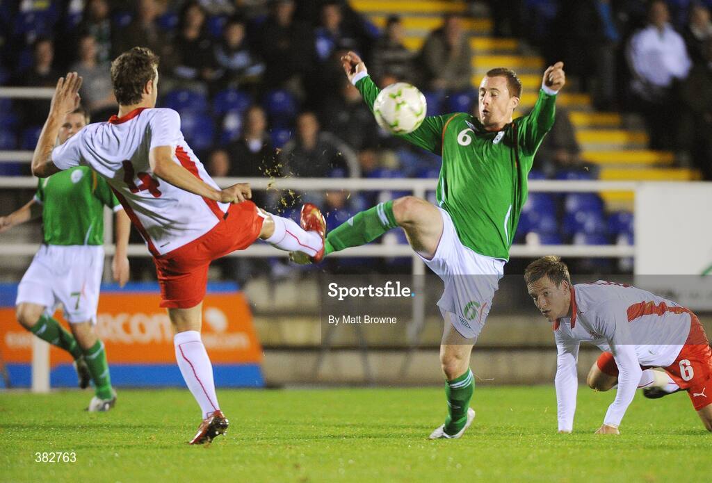 13 October 2009; Scott Davies, Republic of Ireland, is tackled by Jonathan Rossini, Switzerland. UEFA European U21 Championship Qualifier, Republic of Ireland v Switzerland, RSC, Waterford. Picture credit: Matt Browne / SPORTSFILE