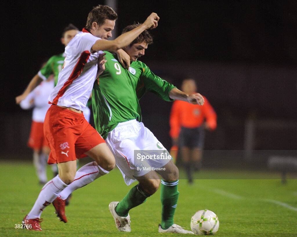 13 October 2009; Cillian Sheridan, Republic of Ireland, is tackled by Jonathan Rossini, Switzerland. UEFA European U21 Championship Qualifier, Republic of Ireland v Switzerland, RSC, Waterford. Picture credit: Matt Browne / SPORTSFILE