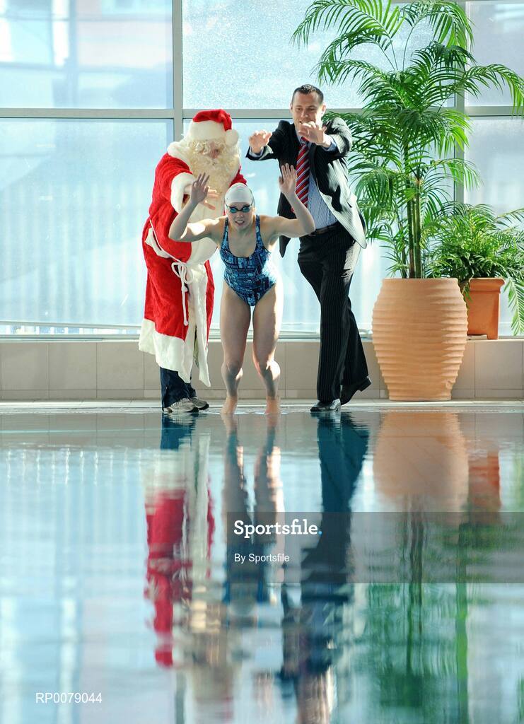 12 October 2009; Former Dublin footballer Ciarán Whelan and Santa push Irish Olympian Aisling Cooney into the pool at the launch of Santa Swim 2009. Ballymun and Finglas Leisure Centre, Ballymun Road, Dublin. Photo by Sportsfile