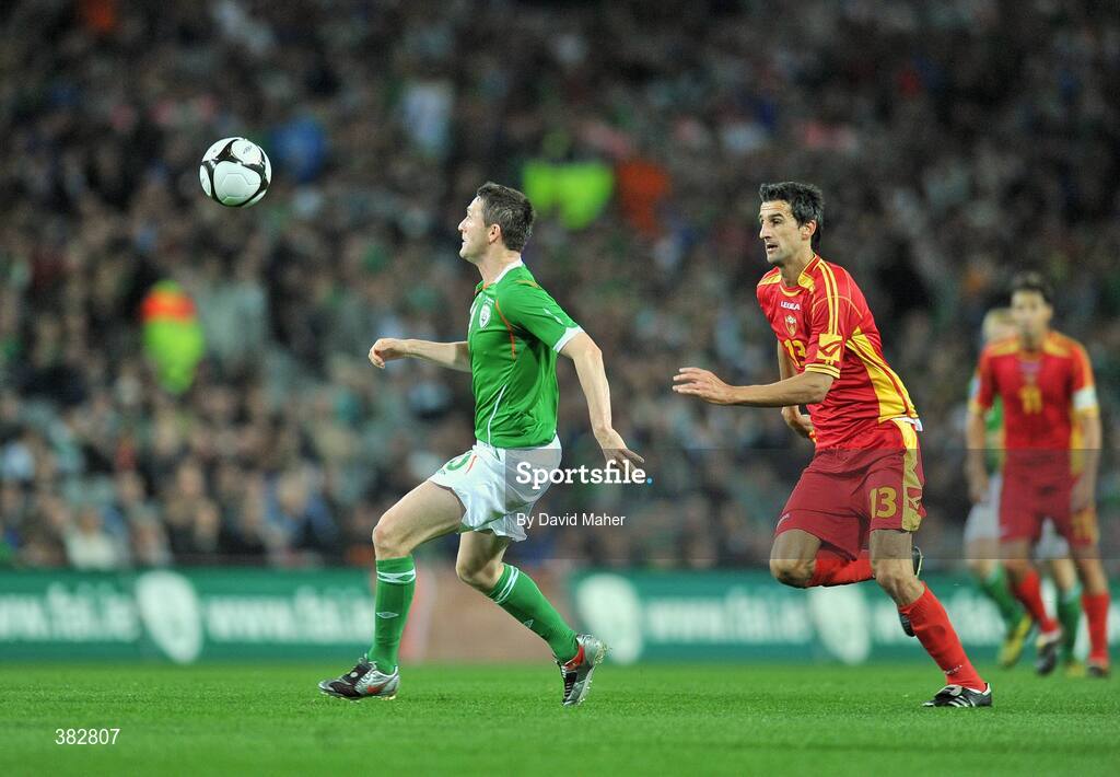14 October 2009; Robbie Keane, Republic of Ireland, in action against Mitar Novakovic, Montenegro. 2010 FIFA World Cup Qualifier, Republic of Ireland v Montenegro, Croke Park, Dublin. Picture credit: David Maher / SPORTSFILE