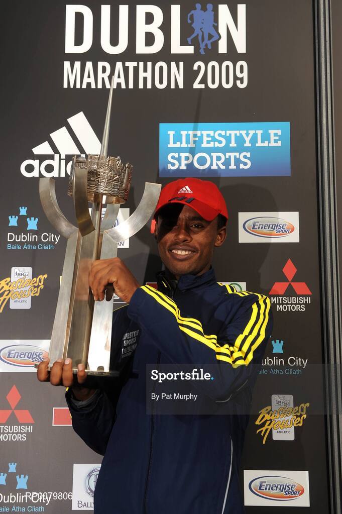 26 October 2009; Feyisa Lilesa, Ethiopia, with the trophy after victory in the Lifestyle Sports - adidas Dublin Marathon 2009. Merrion Square, Dublin. Picture credit: Pat Murphy / SPORTSFILE