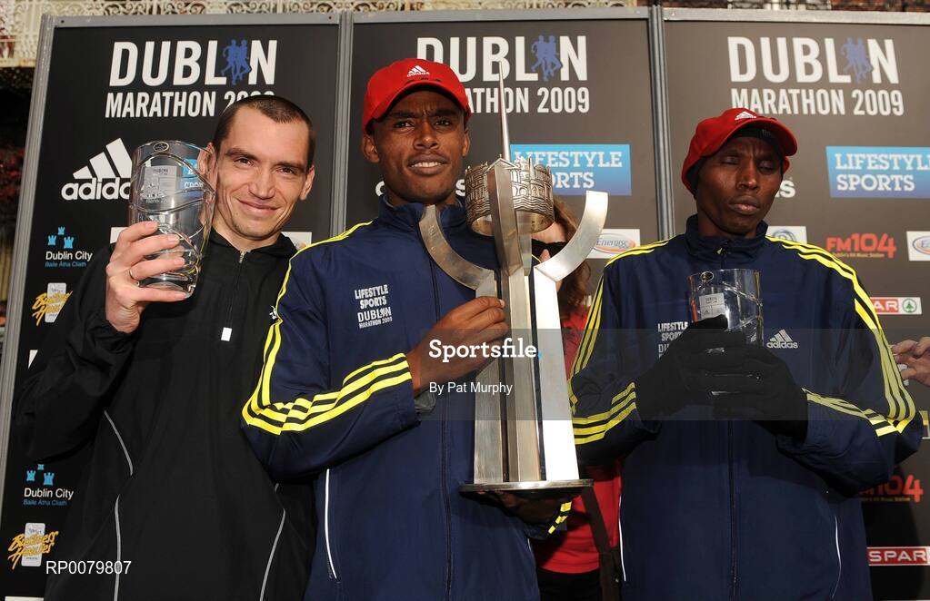 26 October 2009; Feyisa Lilesa, Ethiopia, centre, who won the Lifestyle Sports - adidas Dublin Marathon 2009 with second placed Aleksey Sokolov, Russia, and third placed Serem Noah, Kenya, right. Merrion Square, Dublin. Picture credit: Pat Murphy / SPORTSFILE