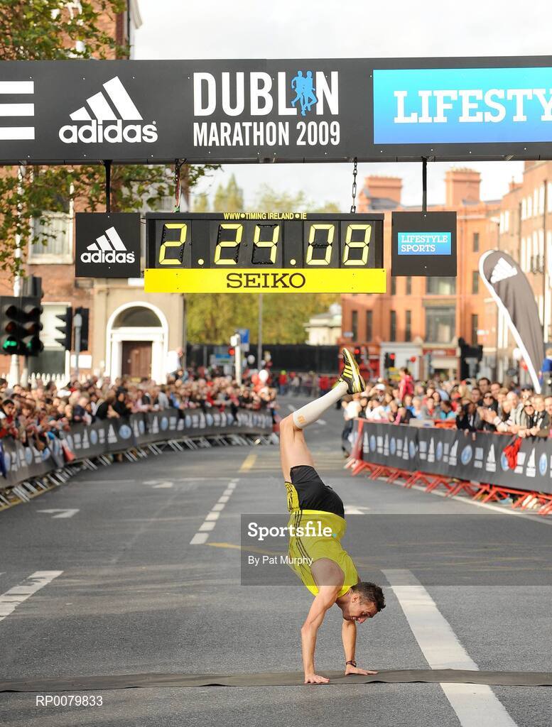 26 October 2009; Thomas Bedford, from London, England, crosses the finish line to complete the Lifestyle Sports - adidas Dublin Marathon 2009. Merrion Square, Dublin. Picture credit: Pat Murphy / SPORTSFILE
