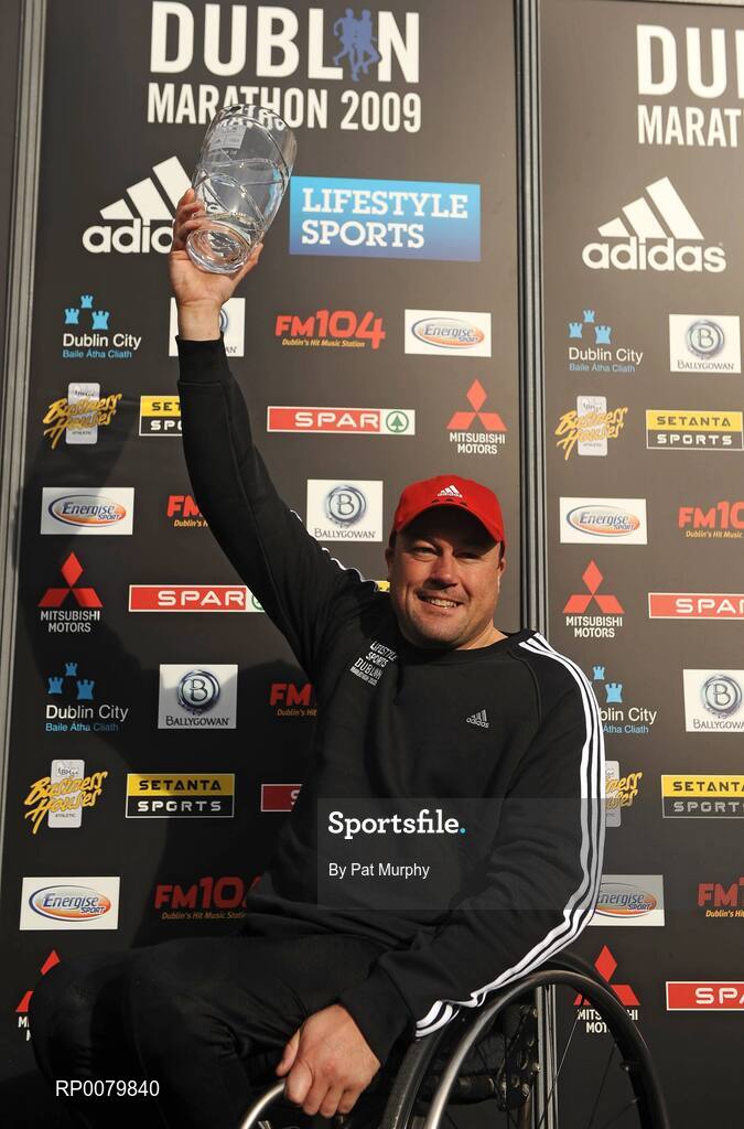 26 October 2009; Richie Powell, from Wales, celebrates with the trophy after winning the wheelchair race at the Lifestyle Sports - adidas Dublin Marathon 2009. Merrion Square, Dublin. Picture credit: Pat Murphy / SPORTSFILE