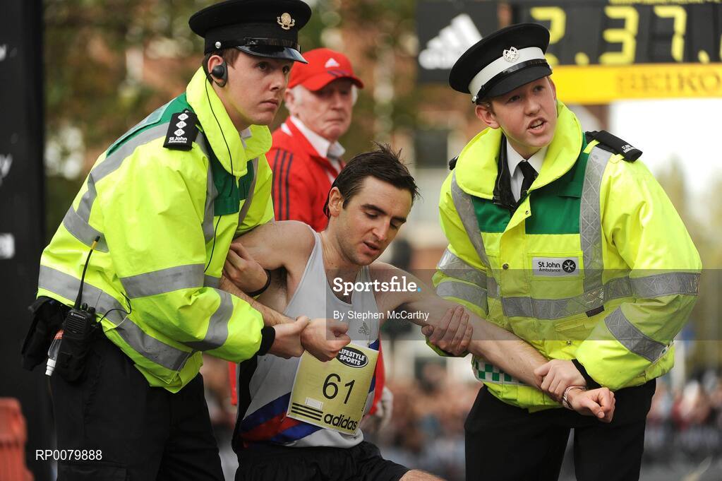 26 October 2009; John Eves, from Dublin, is helped by members of the St. John's Ambulance after completing the Lifestyle Sports - adidas Dublin Marathon 2009. Merrion Square, Dublin. Picture credit: Stephen McCarthy / SPORTSFILE