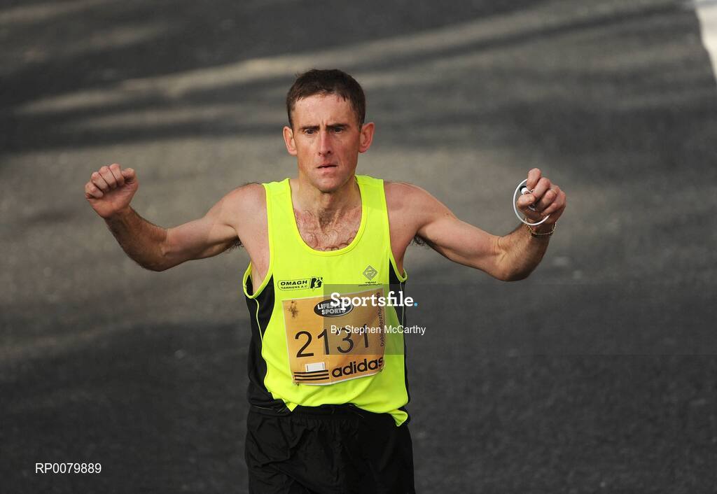 26 October 2009; Martin McLaughlin, from Tyrone, celebrates completing the Lifestyle Sports - adidas Dublin Marathon 2009. Merrion Square, Dublin. Picture credit: Stephen McCarthy / SPORTSFILE