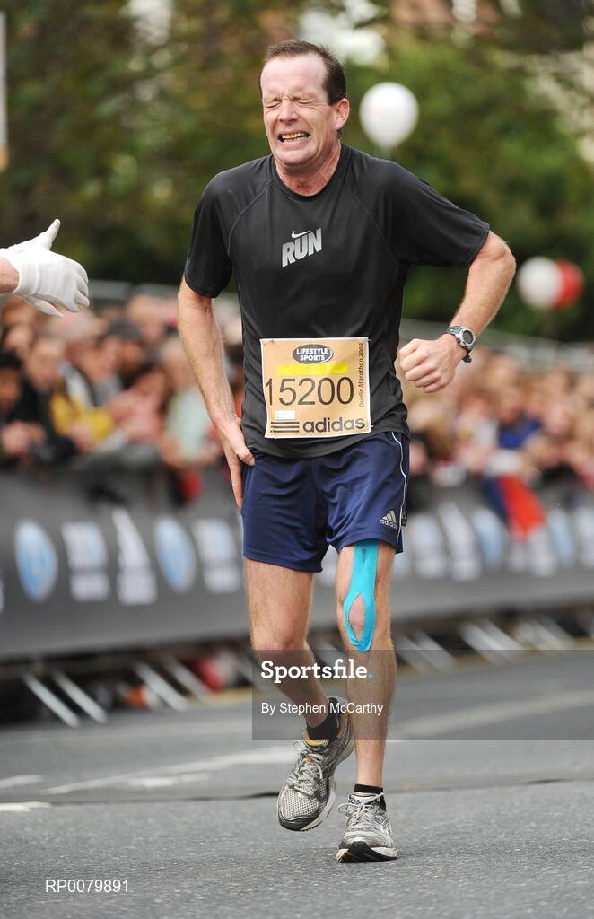 26 October 2009; Michael Boyle, from Dublin, shows his pain after finishing the Lifestyle Sports - adidas Dublin Marathon 2009. Merrion Square, Dublin. Picture credit: Stephen McCarthy / SPORTSFILE