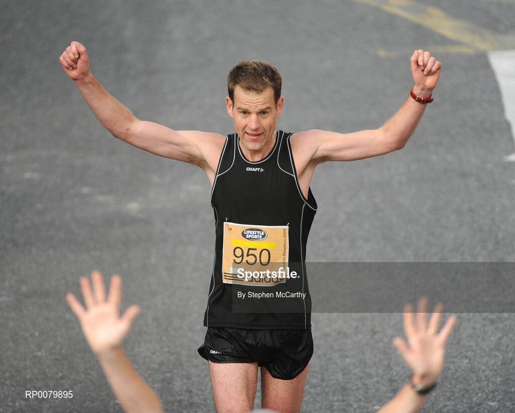 26 October 2009; Peter Gray, from Dublin, celebrates completing the Lifestyle Sports - adidas Dublin Marathon 2009. Merrion Square, Dublin. Picture credit: Stephen McCarthy / SPORTSFILE