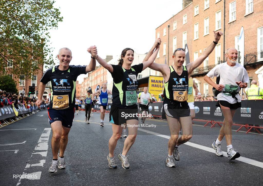 26 October 2009; TV and radio presenter Ray D'Arcy crosses the line with Alison O'Sullivan, from Dublin, and Padraig Swan, from Dublin, during  the Lifestyle Sports - adidas Dublin Marathon 2009. Merrion Square, Dublin. Picture credit: Stephen McCarthy / SPORTSFILE