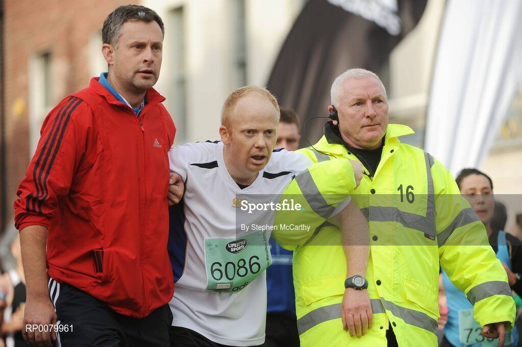 26 October 2009; George Harris, from Greater Manchester, England, is assisted during the Lifestyle Sports - adidas Dublin Marathon 2009. Merrion Square, Dublin. Picture credit: Stephen McCarthy / SPORTSFILE